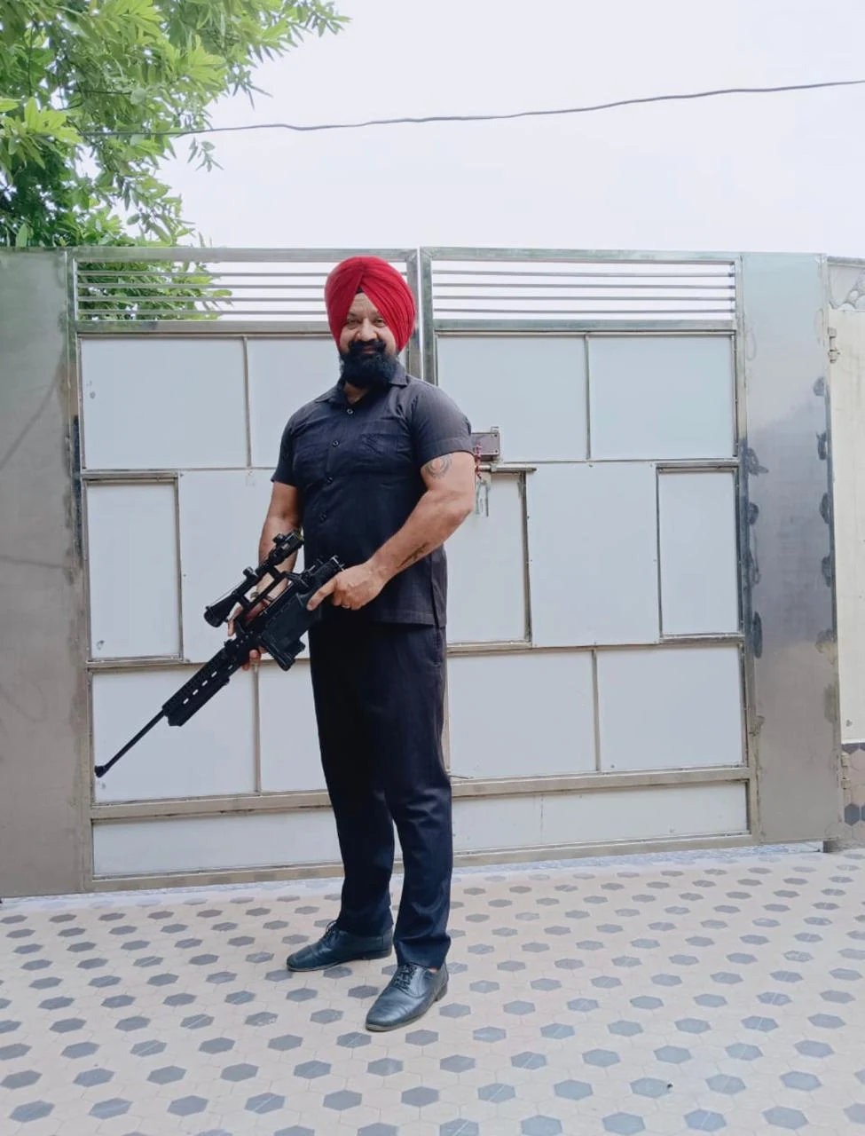 Client-supplied photograph of an armed security team member