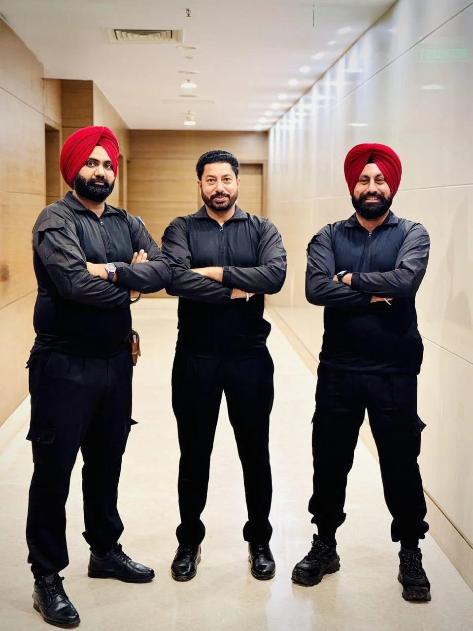 Three R CORPS security professionals in a lobby